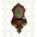 A Victorian mahogany hall wall mirror with carved key well