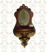A Victorian mahogany hall wall mirror with carved key well