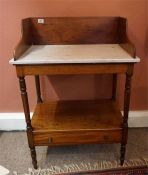 Washstand with turned columns and single drawer to base and mahogany splash back