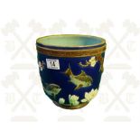 A Majolica Jardinere with raised floral fish decoration impressed to base holdcroft