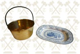 A 19th Century jam pan and a large blue and white ashet, brass trivet and copper kettle