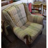 Mahogany framed overstuffed upholstered wing chair