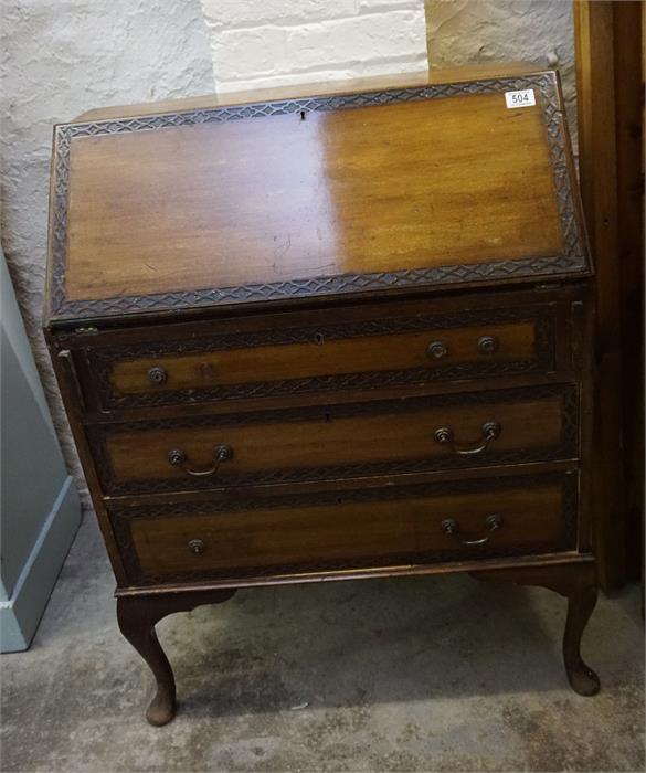 A carved decorated mahogany 3 drawer bureau with fitted interior