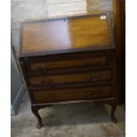 A carved decorated mahogany 3 drawer bureau with fitted interior