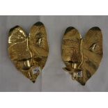 A pair of arts and crafts brass wall candle sconces, leaf design back plated with raised