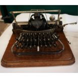 A Blickensdefer typewriter serial no. 73857 fitted in wooden oak case