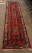 Oriental style patterned runner 112 inches by 33 inches.