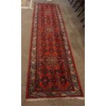 Oriental style patterned runner 112 inches by 33 inches.