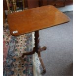 A Georgian mahogany oblong topped lamp table on centre turned column with 3 splayed feet