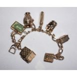 9ct Gold charm bracelet with 8 Gold charms