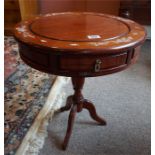 A small reproduction mahogany 2 drawer drum table standing on centre column with splayed feet