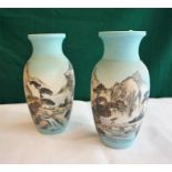 Pair of Oriental ceramic vases with landscape scenes, four figure mark to base.
