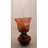 A late Victorian table oil lamp, ruby cut Boheomia glass and a etched crimped top