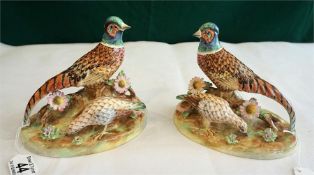 A pair of Crown Staffordshire china ornaments of pheasants modelled by J.T. Jones