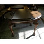 Edwardian mahogany stained wind out dining table with single leaf standing on cabriole legs.