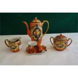 A Naritaki 3 piece porcelain coffee set and egg cruet