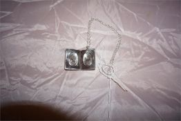 Vintage silver double photo locket and chain, foliage design. Assayed 1970