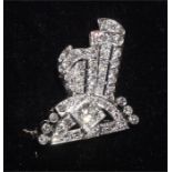 An early 20th century diamond brooch of scrolling