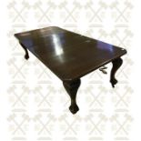 One late Victorian mahogany wind out dining table with two leaves, carved cabriolet legs with ball