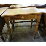 A Victorian Pine table with single drawer to front, the whole standing on turned legs and a square