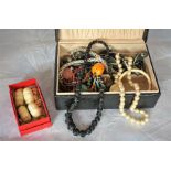 Group of bead necklaces and bone items in jewellery box