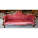 A late Victorian walnut framed parlour settee, with carved carved scrolled back
