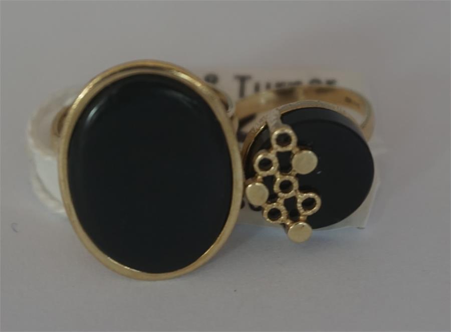Two 9ct gold Onyx set ladies dress rings