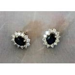 A pair of sapphire and diamond earrings set in white gold