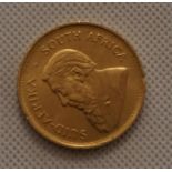 A South African Krugerrand 1oz Gold coin, dated 1975.