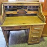 Single pedestal Oak S top Roll top desk, with fitted interior.