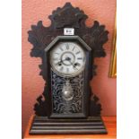 A Victorian American gingerbread mantle clock