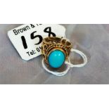 A ladies 9ct gold dress ring, set with a turquoise stone size L