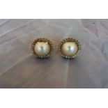 Pair of 18ct gold and stud pearl and diamond encrusted earrings, with all over small diamond stones