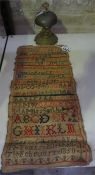 Unframed Victorian sampler dated 1850, also with a counter bell (2)