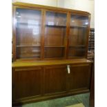 A large Mahogany bookcase, 3 glazed doors to top and 3 blind doors to base