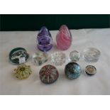 11 assorted glass paperweights