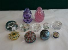 11 assorted glass paperweights