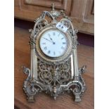 Late Victorian French brass strut mantle clock, raised on a folding easel support