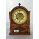 A walnut cased Mantle Clock, with 8 day movement, striking on bell