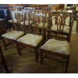 Seven Georgian Oak dining chairs