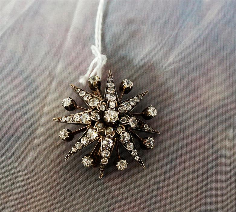 A 19th century yellow gold star burst diamond set brooch, (one small diamond missing) - Image 2 of 2