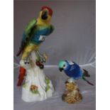 Two 19th Century porcelain parrot figures
