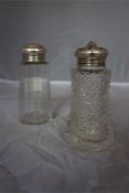 Two Silver topped and glass sugar sifters, hallmarks for London and Sheffield