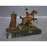 A cold cast hunting table lighter, raised on marble base, in the form of a hunting group