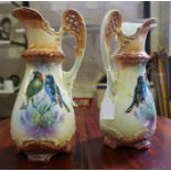 A pair of late 19th century glazed pottery jugs, with bird decoration