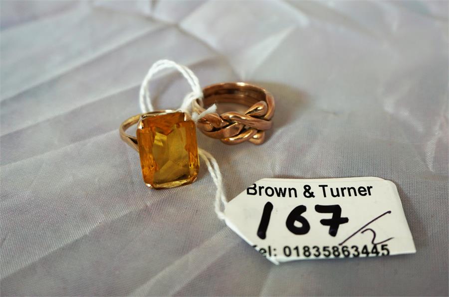 A gold puzzle ring, and a gem set ladies dress ring with oblong cut stone (2)