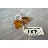 A gold puzzle ring, and a gem set ladies dress ring with oblong cut stone (2)