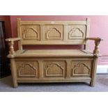 Light Oak monks bench, with hinged metal strap decoration