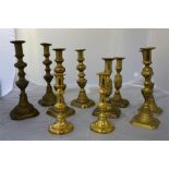Five pairs of brass candle sticks