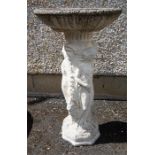 A Stone Bird Bath, decorated with classical figures and masks, 74cm high,
